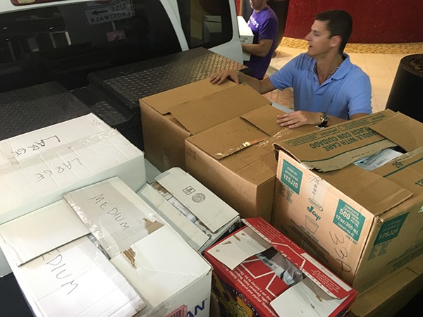 Boxes and packaged shirts from the fundraiser